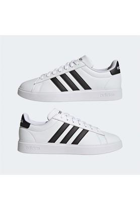 Adidas white tennis outlet shoes with black stripes