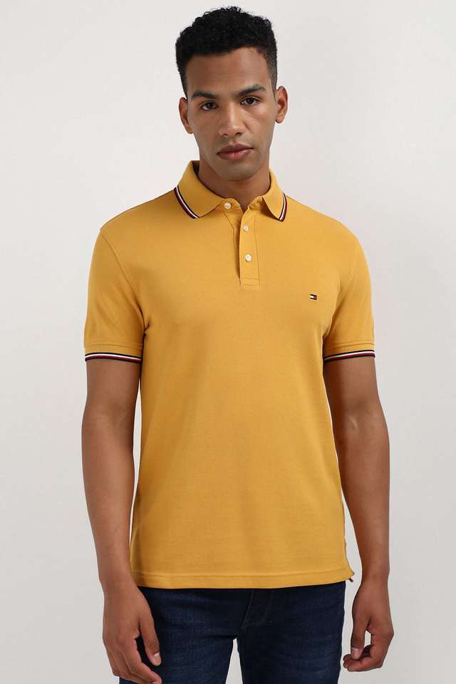 Buy TOMMY HILFIGER Yellow Solid Cotton Polo Men s T Shirt Shoppers Stop