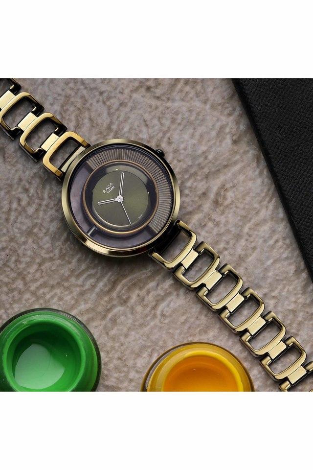 Buy TITAN Womens Moments of Joy Green Dial Brass Analogue Watch 95140QM01 Shoppers Stop