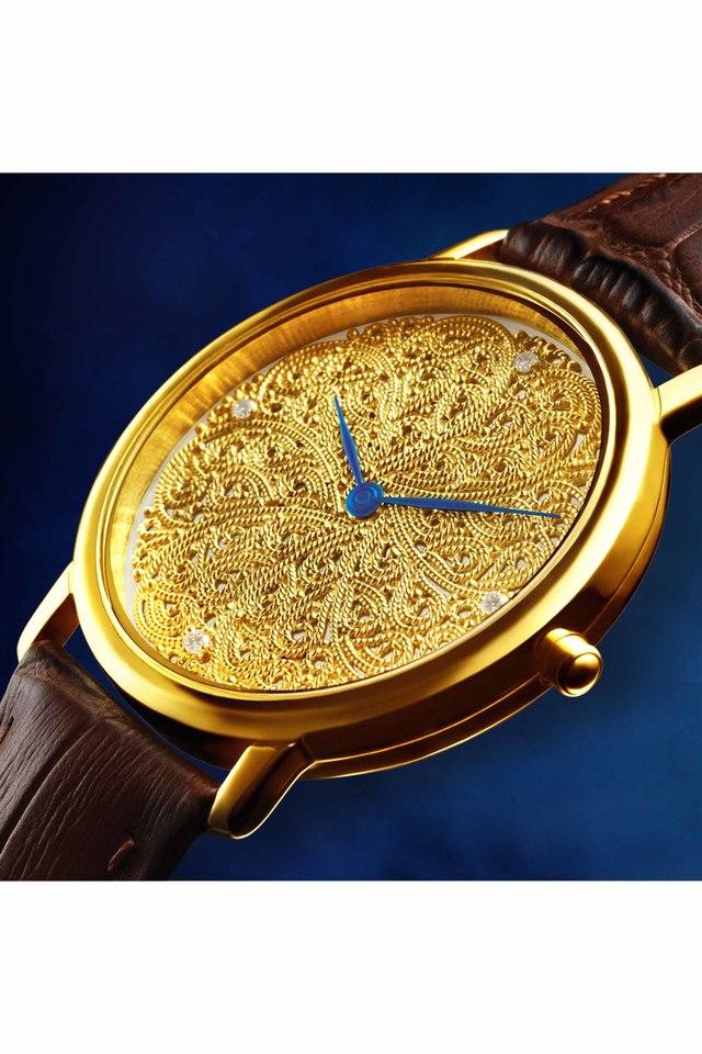 Titan nebula clearance gold watches catalogue