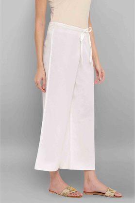 White palazzo pants by Free Living