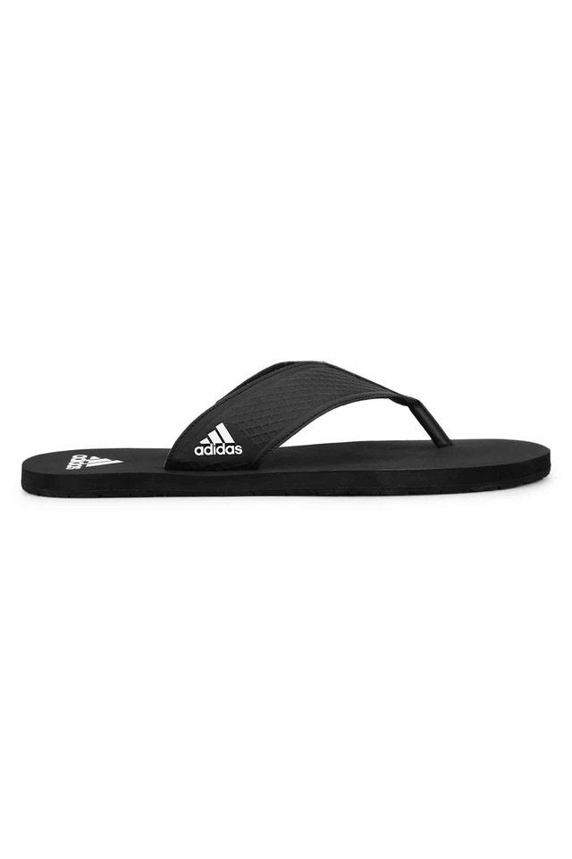 White and best sale black flip flops