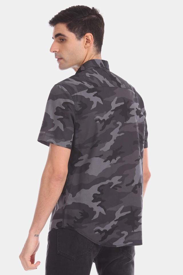 black jeans camo shirt