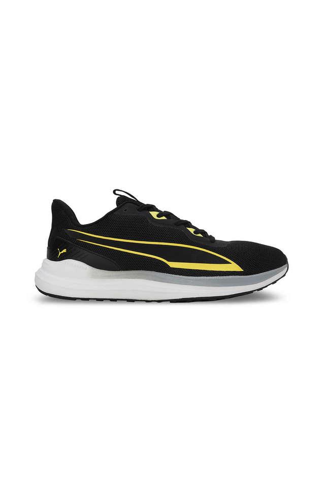 Puma black sale and yellow shoes