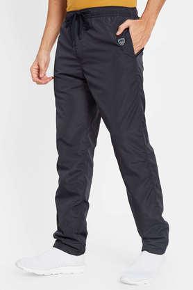 Buy UNDER ARMOUR Men Vital Woven Solid Track Pants - Track Pants