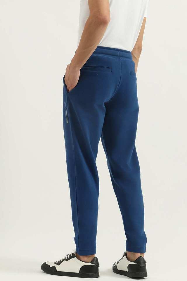 Buy UCB Blue Solid Cotton Regular Fit Men s Track Pants Shoppers Stop