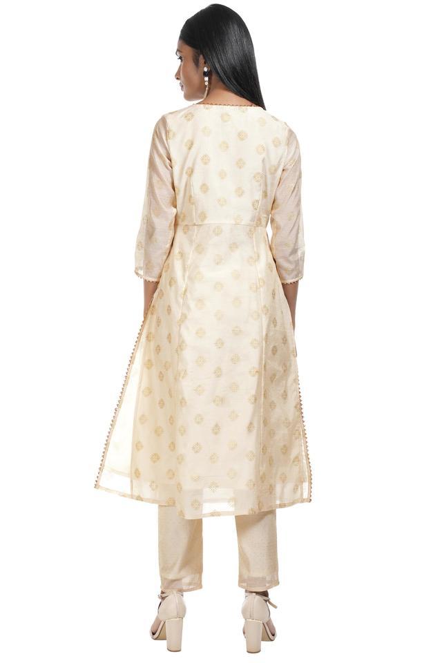 White Oversized short kurta with side slits paired with cigarette pant   akisostore