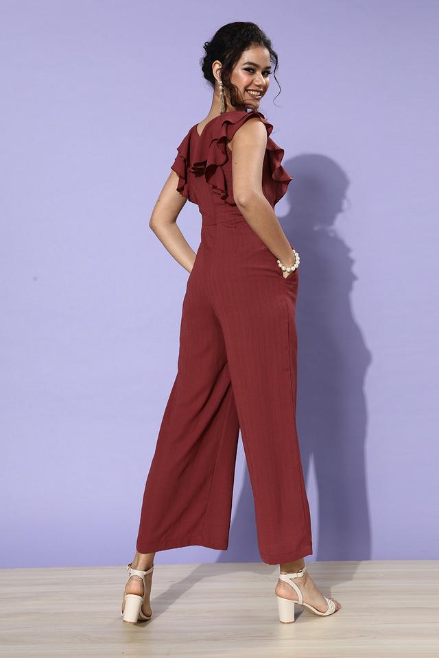 Stylish jeans jumpsuit with turtle buttons and elasticated belt